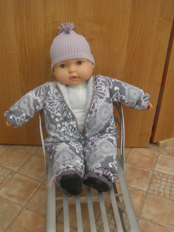 И куколку приодели