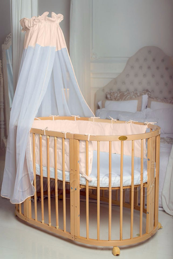 КРОВАТКА- ТРАНСФОРМЕР "COMFORT BABY" .Цена: 25 000 руб.  ХАРАКТЕРИСТИКИ:  возраст детей: 0-5 лет  габариты модели (Д х Ш х В): 1) колыбельки: 78*76*81 см  2) овальной кроватки: 128*76*81 cм  матрас приобретается отдельно.  максимальная нагрузка: 120 кг  Материал: изготавливается только из настоящего массива бука высшего сорта.  сборка: кровать в разобранном виде, простота сборки, инструкция по сборке на русском языке  продукция сертифицирована  производство: Россия  гарантия: 2 года   Дополнительные характеристики: 4 положения по высоте (расстояние положения дна от пола без колес: 1см, 12см, 37см, 57см; расстояние между отверстиями снизу-наверх: 12см, 15см, 20см.); 3 прутика - съемные.  КОНМПЛЕКТАЦИЯ:  1-я ступень - круглая кроватка  2-я ступень - овальная кроватка  3-я ступень - диванчик  4-я ступень - манеж  5-я и 6-я ступени - 2 кресла и столик  7-я ступень - пеленальный столик  ДОПОЛНИТЕЛЬНЫЕ ОПЦИИ:  Комплект постельный "Classic" +6950 руб.  Комплект постельный "Colorit" + 11990 руб.  Фирменный держатель для балдахина +790 руб.  Комплект цельных матрасов " Холкон"/ "Кокос" (круглый+овальный) +8490 руб  Маятник "ComfortBaby Pendulum" 2 в 1+6990 руб.