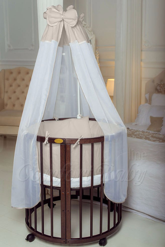 КРОВАТКА- ТРАНСФОРМЕР "COMFORT BABY" .Цена: 25 000 руб.  ХАРАКТЕРИСТИКИ:  возраст детей: 0-5 лет  габариты модели (Д х Ш х В): 1) колыбельки: 78*76*81 см  2) овальной кроватки: 128*76*81 cм  матрас приобретается отдельно.  максимальная нагрузка: 120 кг  Материал: изготавливается только из настоящего массива бука высшего сорта.  сборка: кровать в разобранном виде, простота сборки, инструкция по сборке на русском языке  продукция сертифицирована  производство: Россия  гарантия: 2 года   Дополнительные характеристики: 4 положения по высоте (расстояние положения дна от пола без колес: 1см, 12см, 37см, 57см; расстояние между отверстиями снизу-наверх: 12см, 15см, 20см.); 3 прутика - съемные.  КОНМПЛЕКТАЦИЯ:  1-я ступень - круглая кроватка  2-я ступень - овальная кроватка  3-я ступень - диванчик  4-я ступень - манеж  5-я и 6-я ступени - 2 кресла и столик  7-я ступень - пеленальный столик  ДОПОЛНИТЕЛЬНЫЕ ОПЦИИ:  Комплект постельный "Classic" +6950 руб.  Комплект постельный "Colorit" + 11990 руб.  Фирменный держатель для балдахина +790 руб.  Комплект цельных матрасов " Холкон"/ "Кокос" (круглый+овальный) +8490 руб  Маятник "ComfortBaby Pendulum" 2 в 1+6990 руб.
