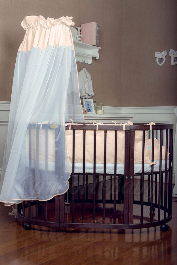 КРОВАТКА- ТРАНСФОРМЕР "COMFORT BABY" .Цена: 25 000 руб.  ХАРАКТЕРИСТИКИ:  возраст детей: 0-5 лет  габариты модели (Д х Ш х В): 1) колыбельки: 78*76*81 см  2) овальной кроватки: 128*76*81 cм  матрас приобретается отдельно.  максимальная нагрузка: 120 кг  Материал: изготавливается только из настоящего массива бука высшего сорта.  сборка: кровать в разобранном виде, простота сборки, инструкция по сборке на русском языке  продукция сертифицирована  производство: Россия  гарантия: 2 года   Дополнительные характеристики: 4 положения по высоте (расстояние положения дна от пола без колес: 1см, 12см, 37см, 57см; расстояние между отверстиями снизу-наверх: 12см, 15см, 20см.); 3 прутика - съемные.  КОНМПЛЕКТАЦИЯ:  1-я ступень - круглая кроватка  2-я ступень - овальная кроватка  3-я ступень - диванчик  4-я ступень - манеж  5-я и 6-я ступени - 2 кресла и столик  7-я ступень - пеленальный столик  ДОПОЛНИТЕЛЬНЫЕ ОПЦИИ:  Комплект постельный "Classic" +6950 руб.  Комплект постельный "Colorit" + 11990 руб.  Фирменный держатель для балдахина +790 руб.  Комплект цельных матрасов " Холкон"/ "Кокос" (круглый+овальный) +8490 руб  Маятник "ComfortBaby Pendulum" 2 в 1+6990 руб.
