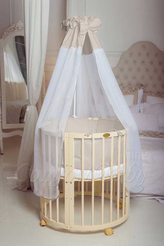 КРОВАТКА- ТРАНСФОРМЕР "COMFORT BABY" .Цена: 25 000 руб.  ХАРАКТЕРИСТИКИ:  возраст детей: 0-5 лет  габариты модели (Д х Ш х В): 1) колыбельки: 78*76*81 см  2) овальной кроватки: 128*76*81 cм  матрас приобретается отдельно.  максимальная нагрузка: 120 кг  Материал: изготавливается только из настоящего массива бука высшего сорта.  сборка: кровать в разобранном виде, простота сборки, инструкция по сборке на русском языке  продукция сертифицирована  производство: Россия  гарантия: 2 года   Дополнительные характеристики: 4 положения по высоте (расстояние положения дна от пола без колес: 1см, 12см, 37см, 57см; расстояние между отверстиями снизу-наверх: 12см, 15см, 20см.); 3 прутика - съемные.  КОНМПЛЕКТАЦИЯ:  1-я ступень - круглая кроватка  2-я ступень - овальная кроватка  3-я ступень - диванчик  4-я ступень - манеж  5-я и 6-я ступени - 2 кресла и столик  7-я ступень - пеленальный столик  ДОПОЛНИТЕЛЬНЫЕ ОПЦИИ:  Комплект постельный "Classic" +6950 руб.  Комплект постельный "Colorit" + 11990 руб.  Фирменный держатель для балдахина +790 руб.  Комплект цельных матрасов " Холкон"/ "Кокос" (круглый+овальный) +8490 руб  Маятник "ComfortBaby Pendulum" 2 в 1+6990 руб.