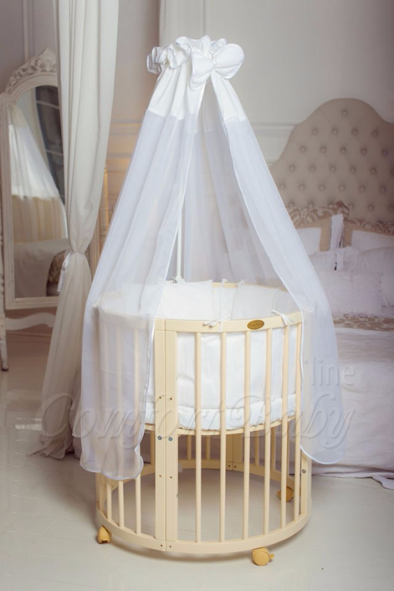 КРОВАТКА- ТРАНСФОРМЕР "COMFORT BABY" .Цена: 25 000 руб.  ХАРАКТЕРИСТИКИ:  возраст детей: 0-5 лет  габариты модели (Д х Ш х В): 1) колыбельки: 78*76*81 см  2) овальной кроватки: 128*76*81 cм  матрас приобретается отдельно.  максимальная нагрузка: 120 кг  Материал: изготавливается только из настоящего массива бука высшего сорта.  сборка: кровать в разобранном виде, простота сборки, инструкция по сборке на русском языке  продукция сертифицирована  производство: Россия  гарантия: 2 года   Дополнительные характеристики: 4 положения по высоте (расстояние положения дна от пола без колес: 1см, 12см, 37см, 57см; расстояние между отверстиями снизу-наверх: 12см, 15см, 20см.); 3 прутика - съемные.  КОНМПЛЕКТАЦИЯ:  1-я ступень - круглая кроватка  2-я ступень - овальная кроватка  3-я ступень - диванчик  4-я ступень - манеж  5-я и 6-я ступени - 2 кресла и столик  7-я ступень - пеленальный столик  ДОПОЛНИТЕЛЬНЫЕ ОПЦИИ:  Комплект постельный "Classic" +6950 руб.  Комплект постельный "Colorit" + 11990 руб.  Фирменный держатель для балдахина +790 руб.  Комплект цельных матрасов " Холкон"/ "Кокос" (круглый+овальный) +8490 руб  Маятник "ComfortBaby Pendulum" 2 в 1+6990 руб.
